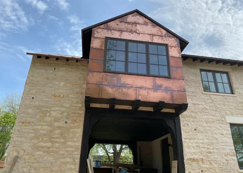 Copper metal panel facade on a stone building for Metal Roof Coating in Wailea