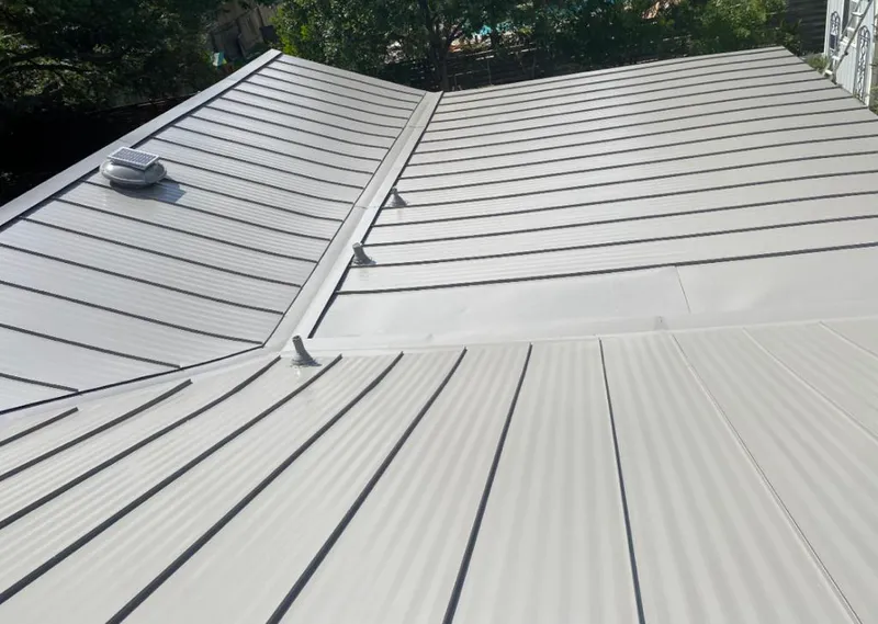 Solar attic fan installed on a metal roof for Roof Ventilation in Wailea
